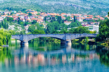 Obraz premium Old bridge over river Trebisnjica in Trebinje, Bosnia and Herzegovina.
