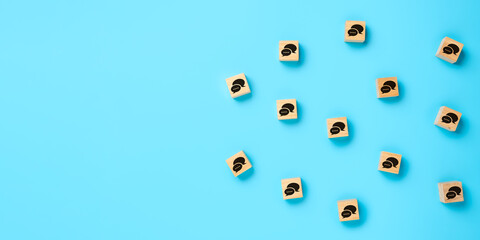 Online communication concept, Many wooden cubes with speech bubble icons on blue background, social networking.