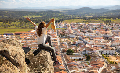 woman enjoying panoramic view of Spain city - obrazy, fototapety, plakaty