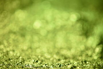 Green glitter lights texture. Abstract christmas background.