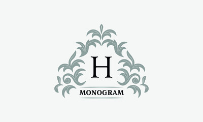 Monogram H. Luxurious floral logo with calligraphic elegant ornament lines. Business sign, identity for restaurant, boutique, cafe, hotel, heraldic, fashion and other vector illustrations