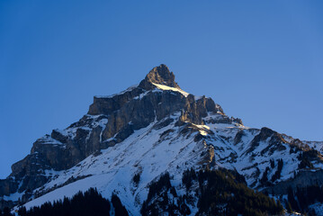 Aerial view of mountain panorama at the Swiss Alps seen from ski resort Engelberg, focus on...