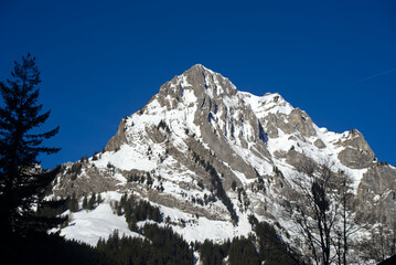 Aerial view of mountain panorama at the Swiss Alps seen from ski resort Engelberg, focus on...