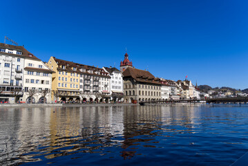 Fototapeta na wymiar Cityscape of medieval old town of Luzern with river Reuss on a sunny winter day. Photo taken February 9th, 2022, Lucerne, Switzerland.