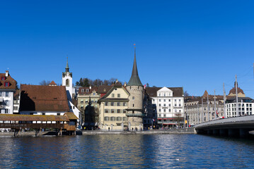 Obraz na płótnie Canvas Cityscape of medieval old town of Luzern with river Reuss on a sunny winter day. Photo taken February 9th, 2022, Lucerne, Switzerland.