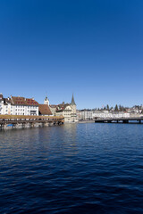 Cityscape of medieval old town of Luzern with river Reuss on a sunny winter day. Photo taken February 9th, 2022, Lucerne, Switzerland.