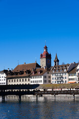 Fototapeta na wymiar Cityscape of medieval old town of Luzern with river Reuss on a sunny winter day. Photo taken February 9th, 2022, Lucerne, Switzerland.