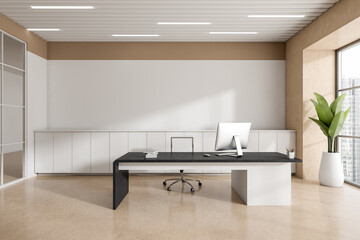 Front view on bright office room interior with directors desktop