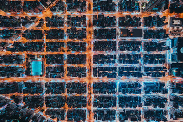 Aerial view of intersection in Hong Kong Downtown. Financial district and business centers in smart city, technology concept. Top view of buildings at night.