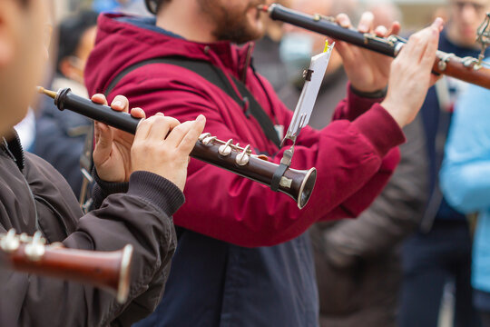 Musicians not unrecognizable playing the Gralla at a popular event in Barcelona (Spain), hand-selective approach.
