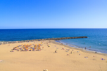 Fototapeta na wymiar Beach life at Playa Del Ingles Beach, Gran Canaria, Spain