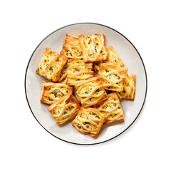 Puff pastry squares filled with feta cheese and spinach isolated on white background, top view