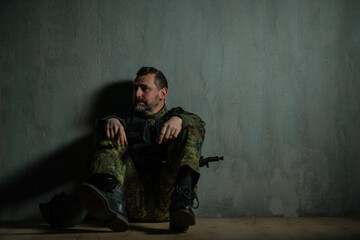 Frustrated military soldier sitting in boot camp