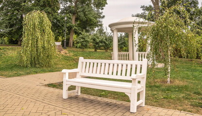 Bench and gazebo-rotunda in the park