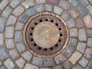Sewer manhole lined with stones