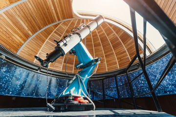 A professional telescope in a space observatory with automatic bearing and platform rotation mechanisms