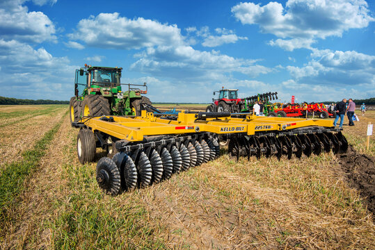 Bilogirya, Khmelnytsky region, UKRAINE - August 19, 2021: tractor with disc harrow in operation at the demonstration of agricultural machinery