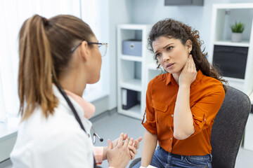Woman having a neck pain. Doctor working in the office and listening to the patient, she is explaining her symptoms, healtcare and assistance concept
