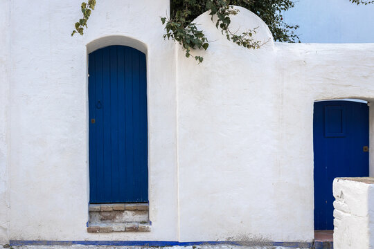 Beautiful blue door and white wall in Sitges, Spain.