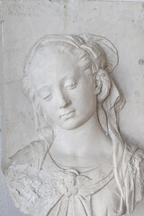 Bust of a girl - bas-relief, plaster model, cast, object for drawing. The study of human anatomy. Model for drawing from nature. Drawing lessons, academic drawing.