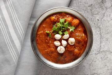 Paneer makhana curry dish on table
