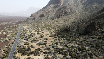 Fototapeta na wymiar Aerial view from road through desert volcanic landscape