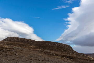 Scenery with clouds and blue sky over the raw coast of Snaefellsnes peninsula, Iceland