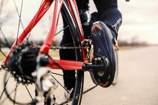 Close up of foot pedalling bicycle.