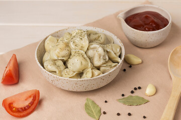 traditional russian pelmeni ravioli on table
