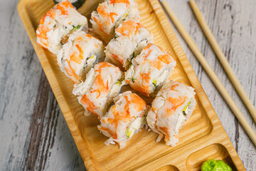 Tasty sushi rolls with shrimp  on the white  table. Top view.