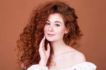 Portrait of a young beautiful red hair girl