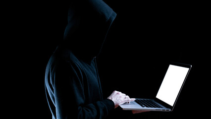 Cyber hacker attack concept. Internet web hack technology. Digital laptop in hacker man hand isolated on black. Information security terms cybersecurity banner.