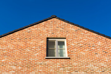 Gabled roof old brick house in Gavere town, located in the Belgian province of east flanders, Belgium