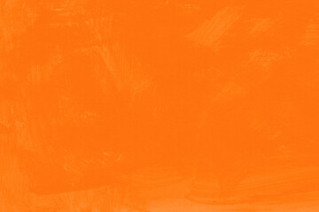 オレンジ色の絵具を塗った無地背景