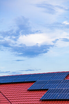 Solar panels on red tiled roof of home