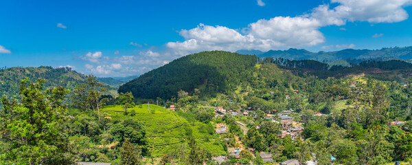 Fototapeta na wymiar Panorama view opver Ella gap, the view of mountains around Ella with tea plantation, Sri Lanka
