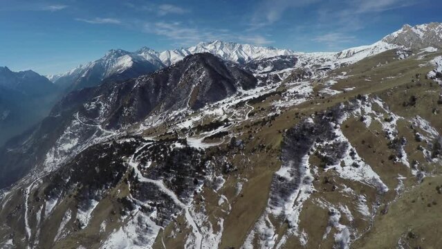 Caucasus, Ossetia. Alagir Gorge. Winter alpine meadow with pines.