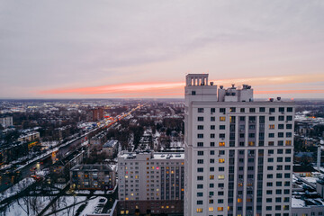 Fototapeta na wymiar evening city, city lights shooting from a quadcopter,sunset