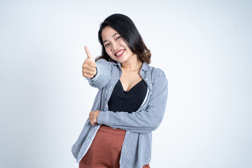 attractive young woman stand with thumbs up on isolated background