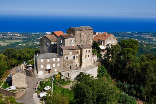 Panoramic view of dreamy mountain village Santa Lucia di Moriani in Castagniccia overlooking the Mediterranean Sea. Corsica, France.