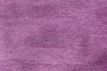 Texture of purple jeans. purple background. Denim