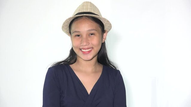 A Smiling Filipina Girl Wearing Hat