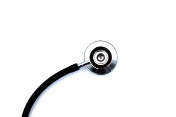 Plakat On a white isolated background lies a black stethoscope.