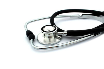 On a white isolated background lies a black stethoscope.