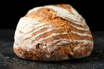 Bread, traditional sourdough bread on a rustic table
