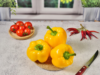 Tomatoes and paprika, vegetables on a wooden board