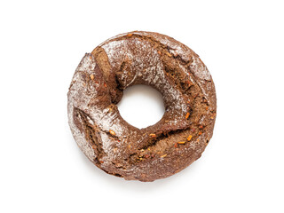 Kalach - round bread in the shape of a ring with a hole, top view on a white background