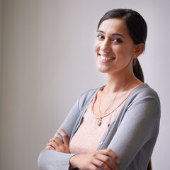 smiling woman with crossed hands. Portrait of a smiling woman with her arms crossed.