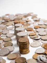 Close-up of a lot of Russian ruble coins on a white background. Some of them are arranged in columns. The concept of wealth, economy, growth, business. Money, coins