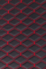 Fototapeta premium a piece of genuine leather. texture. stitch with a red thread. close-up.
